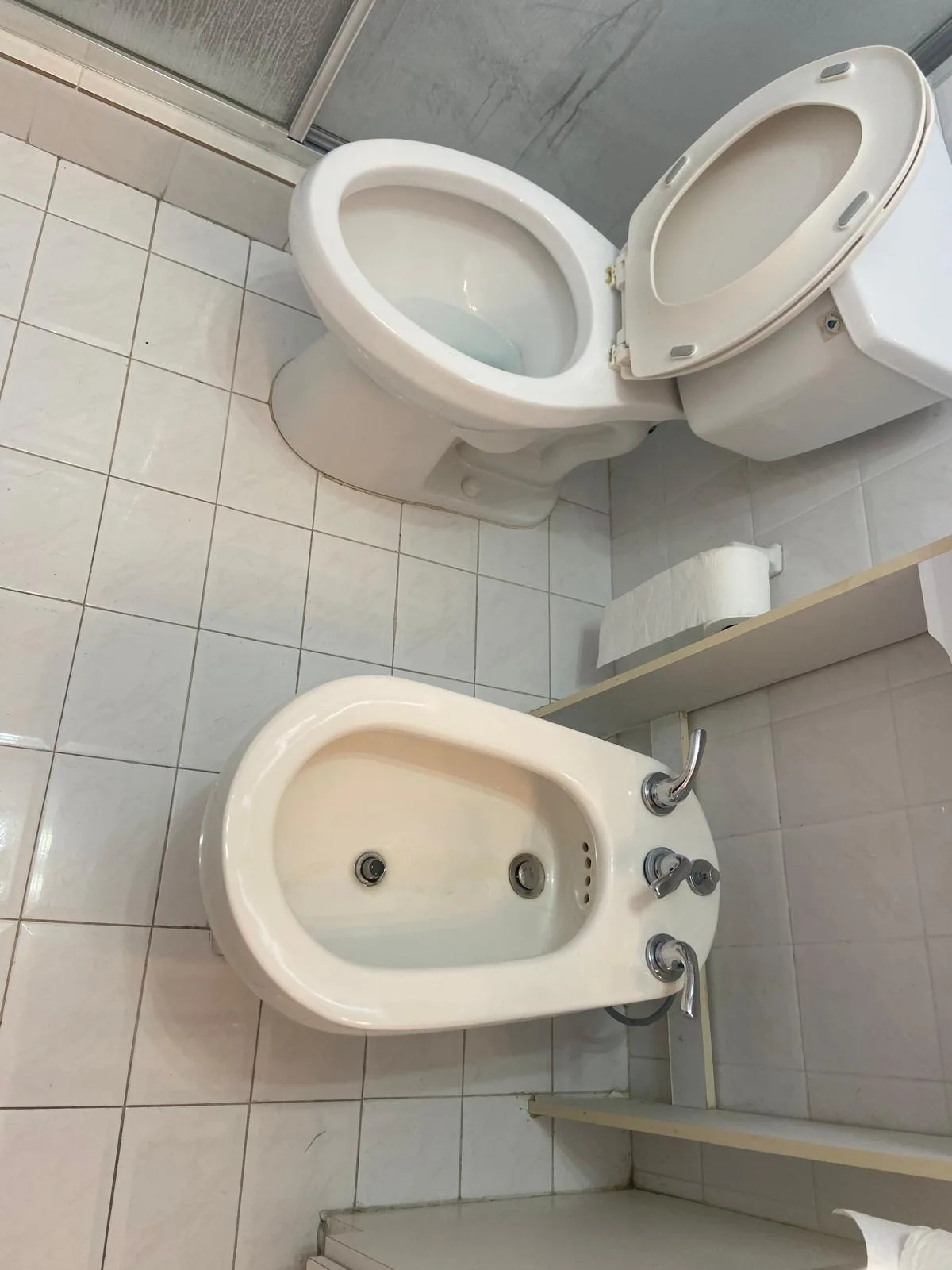 Bathroom with toilet and bidet cleaned and disinfected