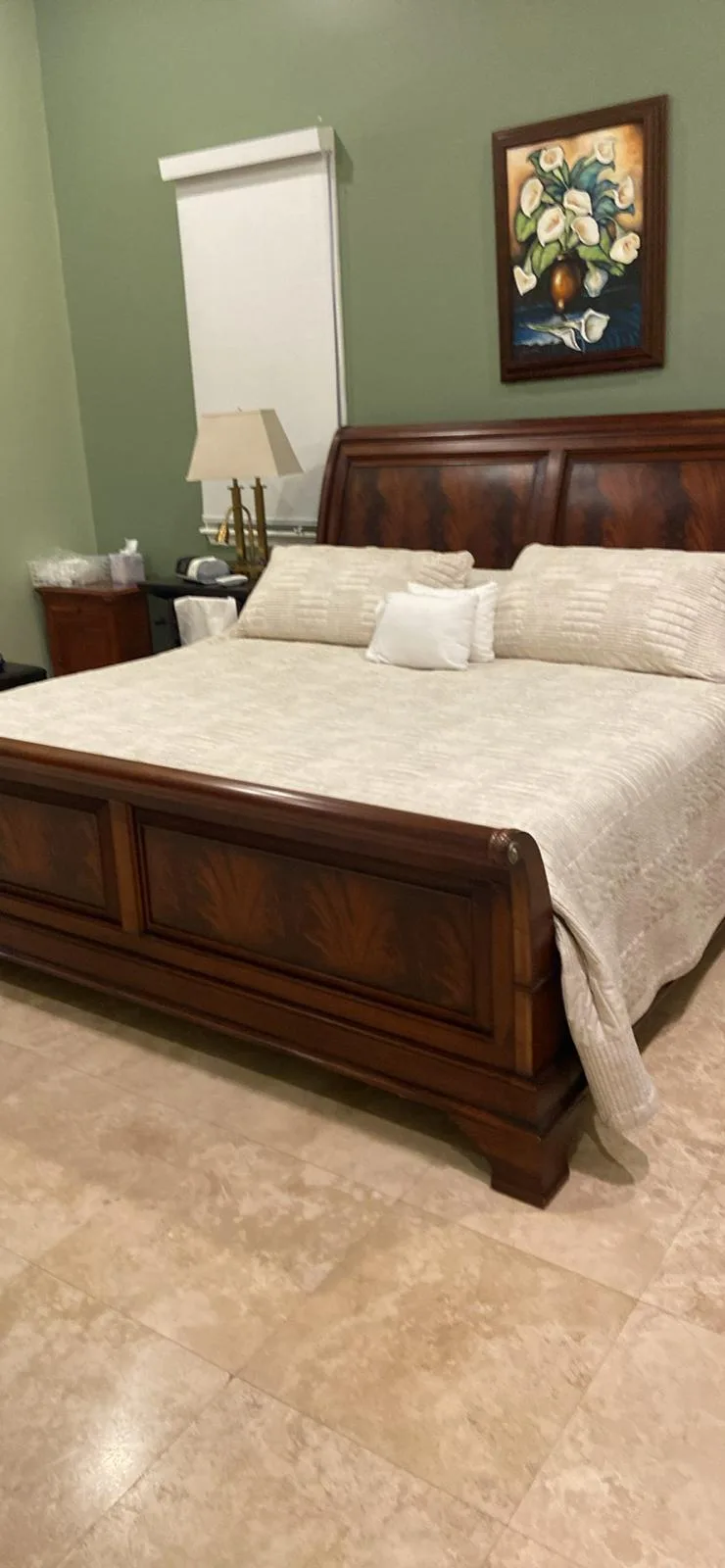 Bedroom cleaned with the bed made and linens smoothed
