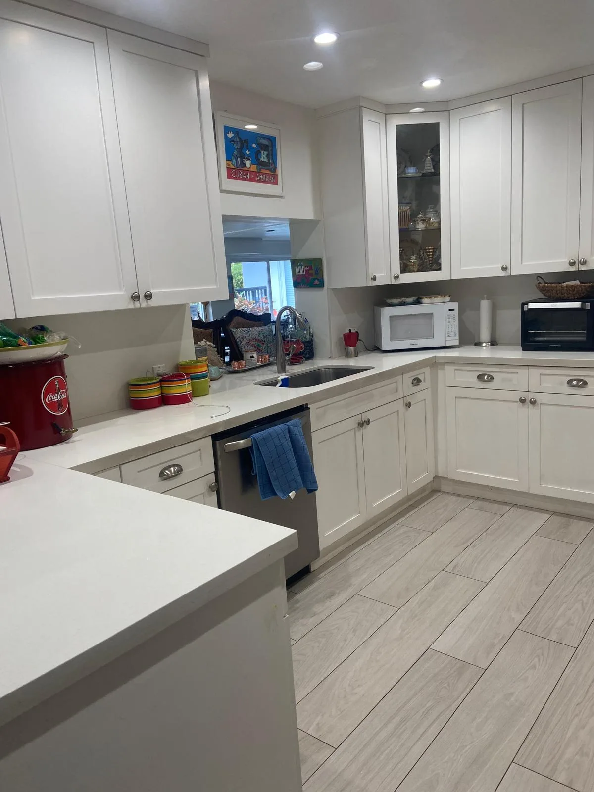 Bright white kitchen cleaned end to end with clear counters